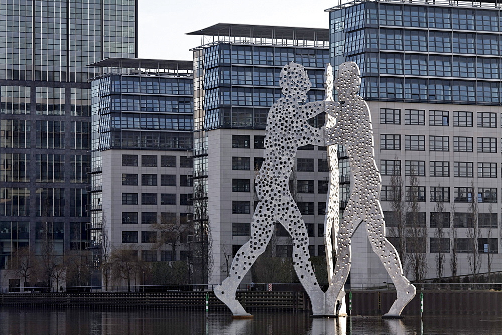 Molecule Man, monumental metal sculpture in the Spree river, Treptowers Allianz administration, Treptow district, Berlin, Germany, Europe