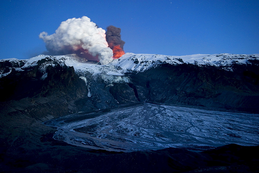 Ash cloud of the Eyjafjallajoekull volcano, steam plume from the lava flow in Gigjoekull glacier tongue, and exit point of the previous flood, Gigjoekull, Iceland, Europe