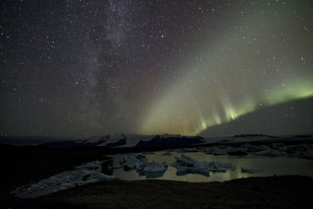 Polar lights (Aurora borealis), and the Milky Way over Joekulsarlon glacial lake and Vatnajoekull glacier, Joekulsarlon glacier lagoon, southern Iceland, Europe