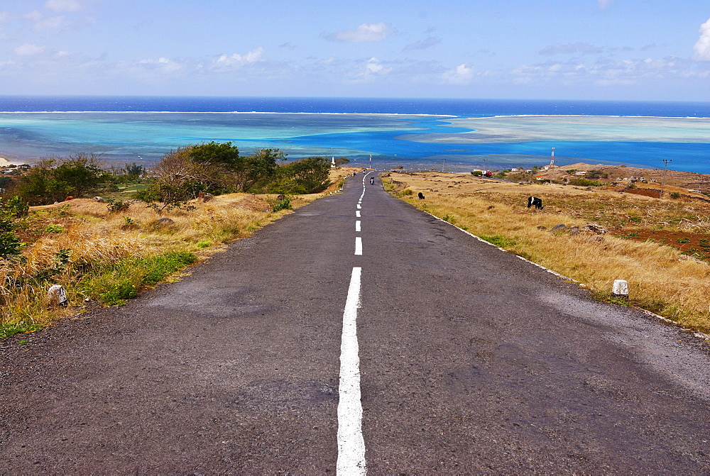 Road leading to the turquoise waters of the Indian Ocean, Rodrigues, Mauritius, Africa