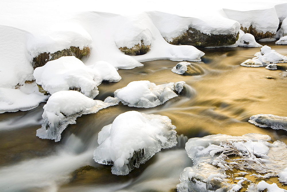 Flowing mountain stream in winter, South Tyrol, Italy, Europe