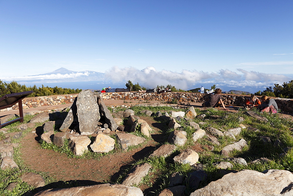 Reconstruction of a ceremonial site of the Guanches, aboriginal inhabitants of the Canary Islands, summit of Garajonay mountain, highest peak of La Gomera island, Tenerife island at the back, La Gomera island, Canary Islands, Spain, Europe