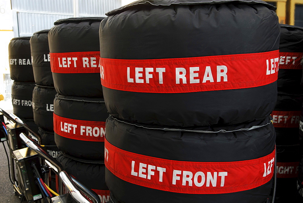 Stacks of Pirelli Formula 1 racing tyres packed in tyre warmers in the paddock at the Circuit Ricardo Tormo near Valencia, Spain, Europe