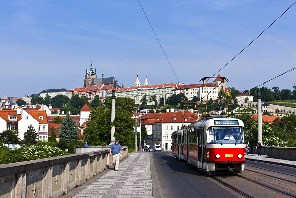 View of a bridge across the Vltava River, Prague Castle at the back, St. Vitus Cathedral, Hradcany district, Prague, Bohemia region, Czech Republic, Europe