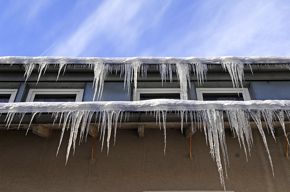 Icicles on the eaves of a hotel, Schlossberg Osternohe, Middle Franconia, Bavaria, Germany, Europe