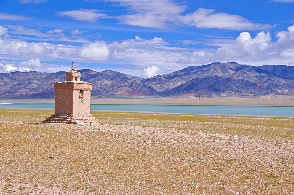 Chorten beside a high mountain lake along the road from Gerze to Tsochen, Western Tibet, Tibet, Asia