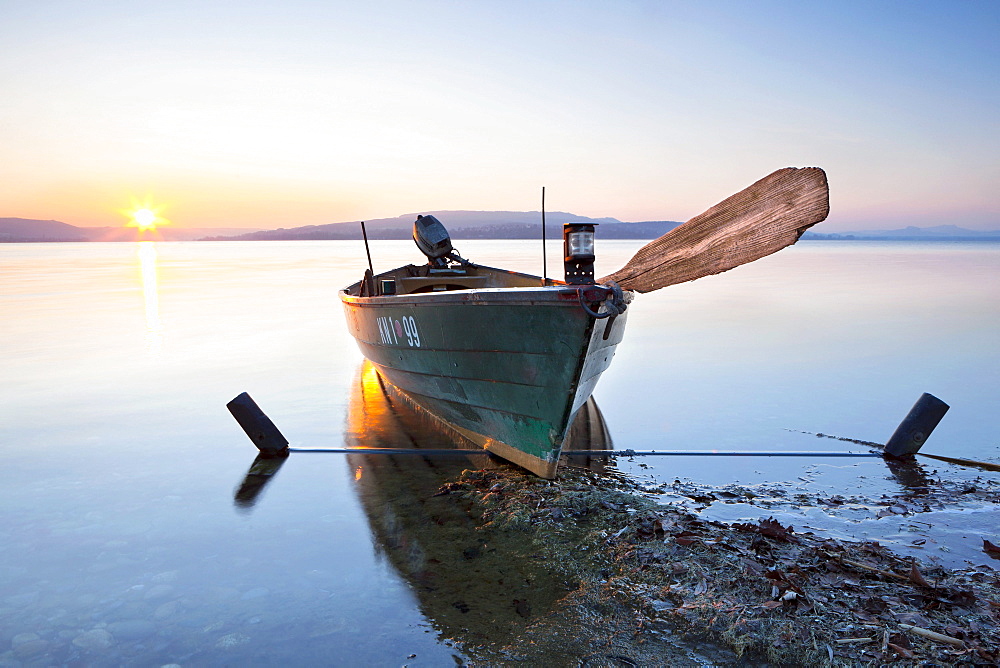 Evening mood with fishing boat on Reichenau island, Baden-Wuerttemberg, Germany, Europe