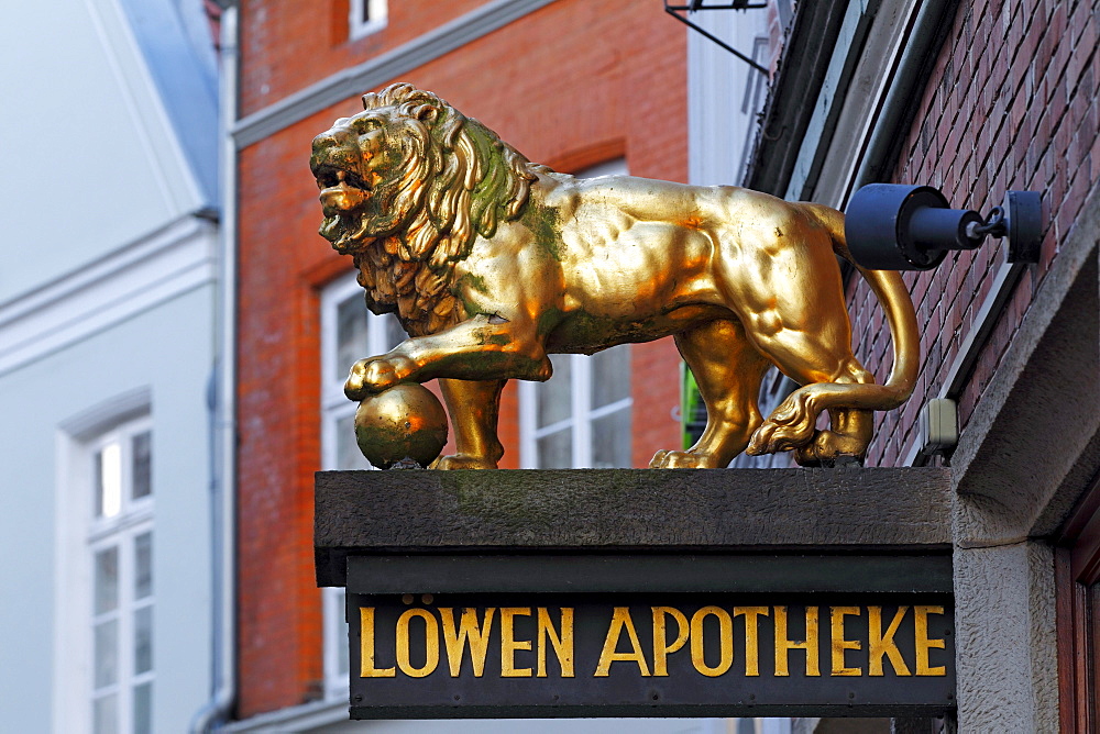 Golden Lion, Loewen Apotheke or lion pharmacy in the old town of Stade, Lower Saxony, Germany, Europe