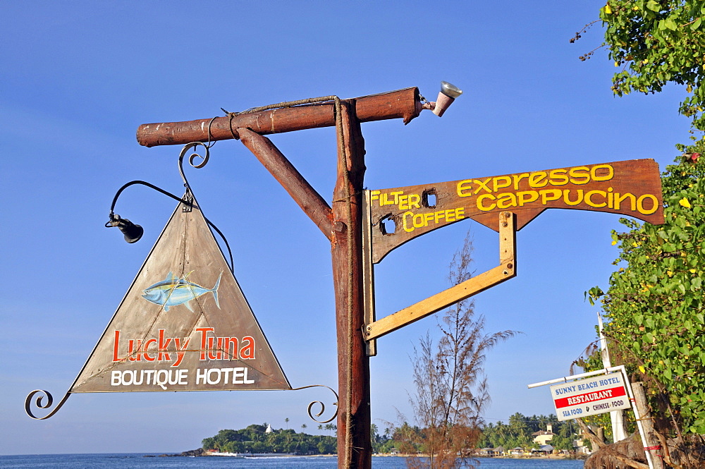 Hotel sign, beach, Unawatuna, Wella Devale Dagoba at the back, Sri Lanka, Ceylon, South Asia, Asia