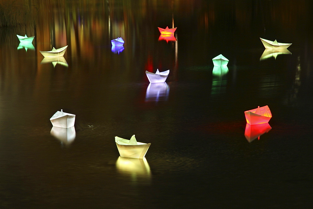 Boats in a lake at Potsdamer Platz during the Festival of Lights 2010, Berlin, Germany, Europe