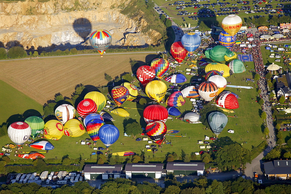 Aerial view, 20th Warsteiner Montgolfiade, hot air balloon festival with nearly 200 hot air balloons ascending into the sky, Warstein, Sauerland, North Rhine-Westphalia, Germany, Europe