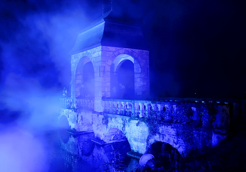 Blue floodlit bridge at the "Illumina" at Schloss Dyck, Juechen, Neuss, North Rhine-Westphalia, Germany, Europe