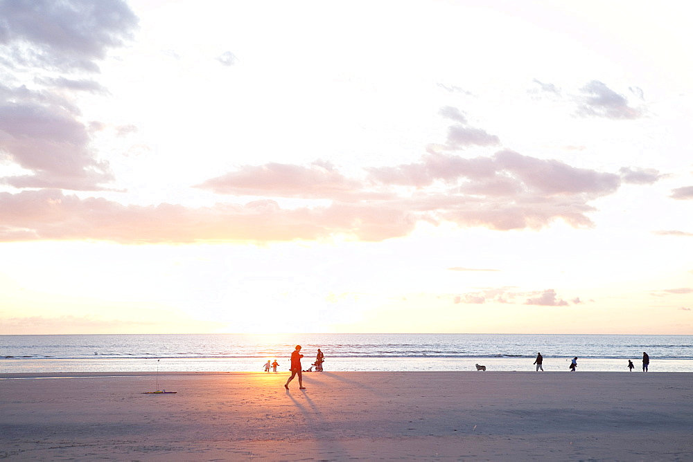 People on the beach at sunset, North Sea, St. Peter-Ording, Schleswig-Holstein, Germany, Europe