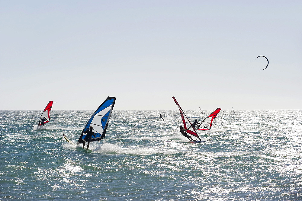 Wind surfers and kite surfers surfing near Tarifa, Costa del Luz, Andalucia, Spain, Europe