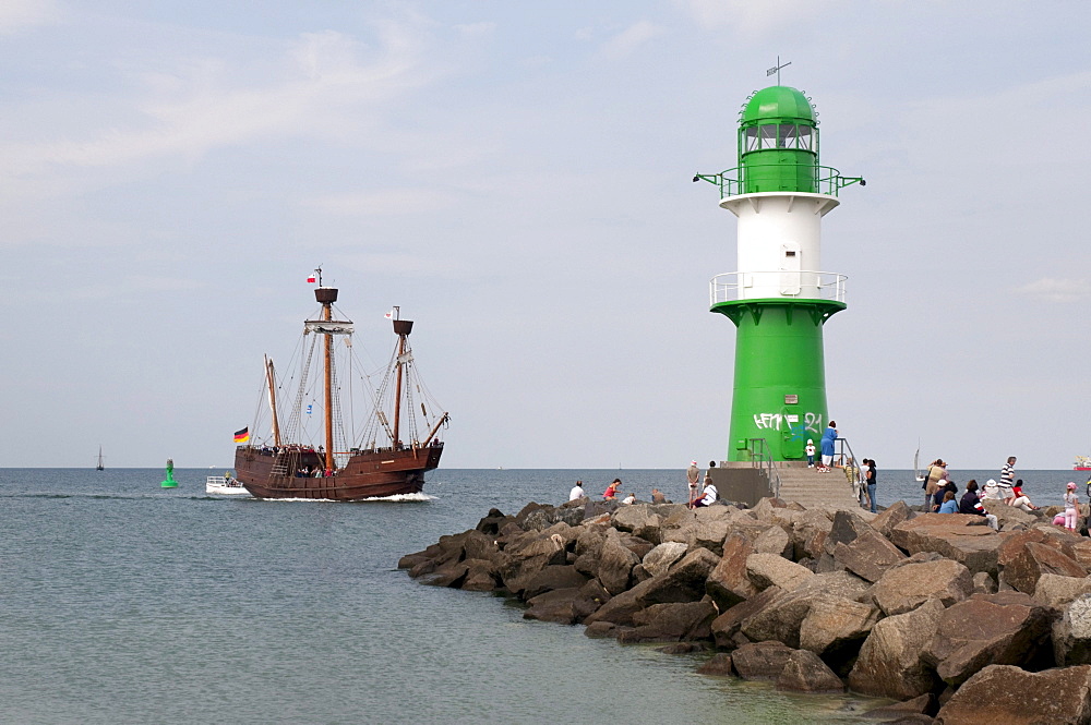 Historic sailing ship and the lighthouse at the harbour entrance, Hanse Sail, a maritime festival, Warnemuende district, Rostock, Mecklenburg-Western Pomerania, Germany, Europe