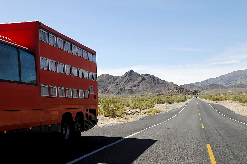 Rotel coach, a bus incorporating a mobile hotel, travelling on Route 178 in Death Valley, Death Valley National Park, California, USA, North America