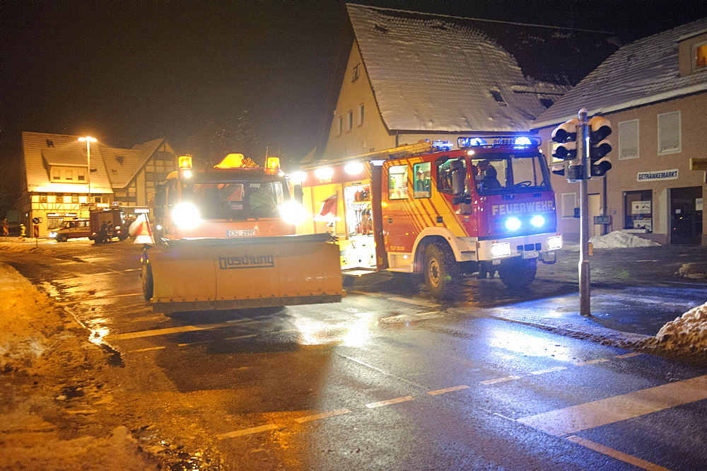 Winter services scattering salt on the road, ice hazard through water used for for firefighting, Kirchheim unter Teck, Baden-Wuerttemberg, Germany, Europe