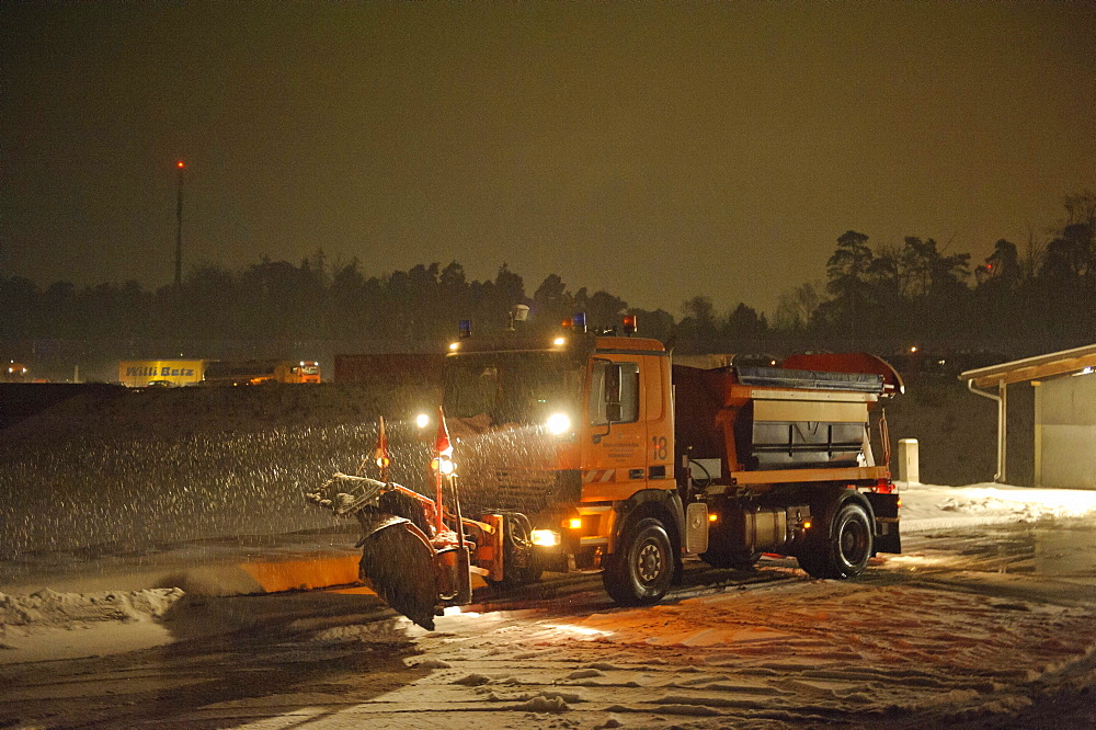 Winter services vehicles are loaded with road salt at the salt storage, motorway junction Stuttgart, Baden-Wuerttemberg, Germany, Europe