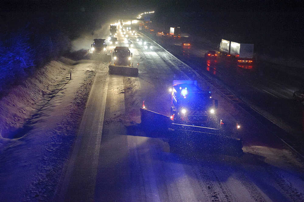 Winter service vehicles in service on the A8 motorway at the Stuttgart junction near Stuttgart-Rohr, Stuttgart, Baden-Wuerttemberg, Germany, Europe