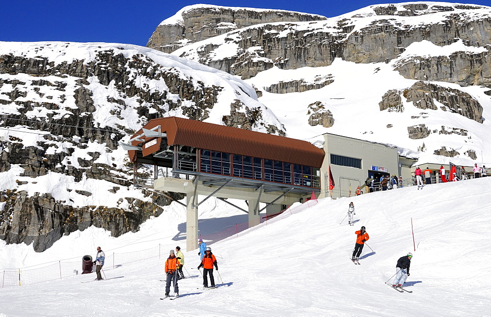 Skiers at the mountain station of the Les Violettes cable car, Crans Montana, Valais, Switzerland, Europe