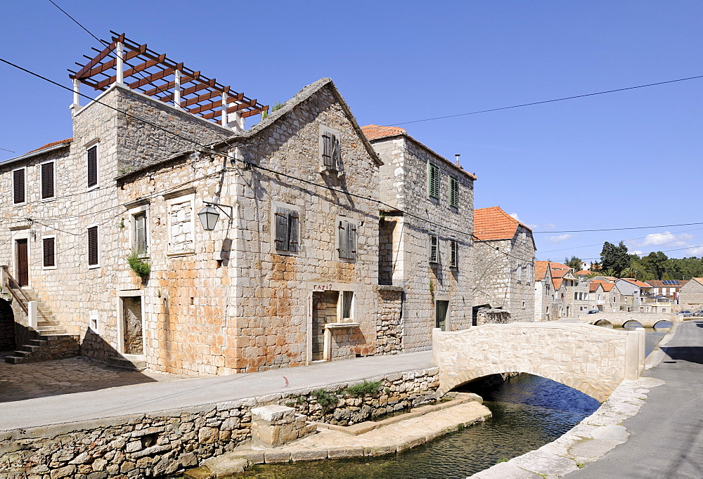 Bridge over the river in the historic town centre, Vrboska, Hvar Island, Croatia, Europe