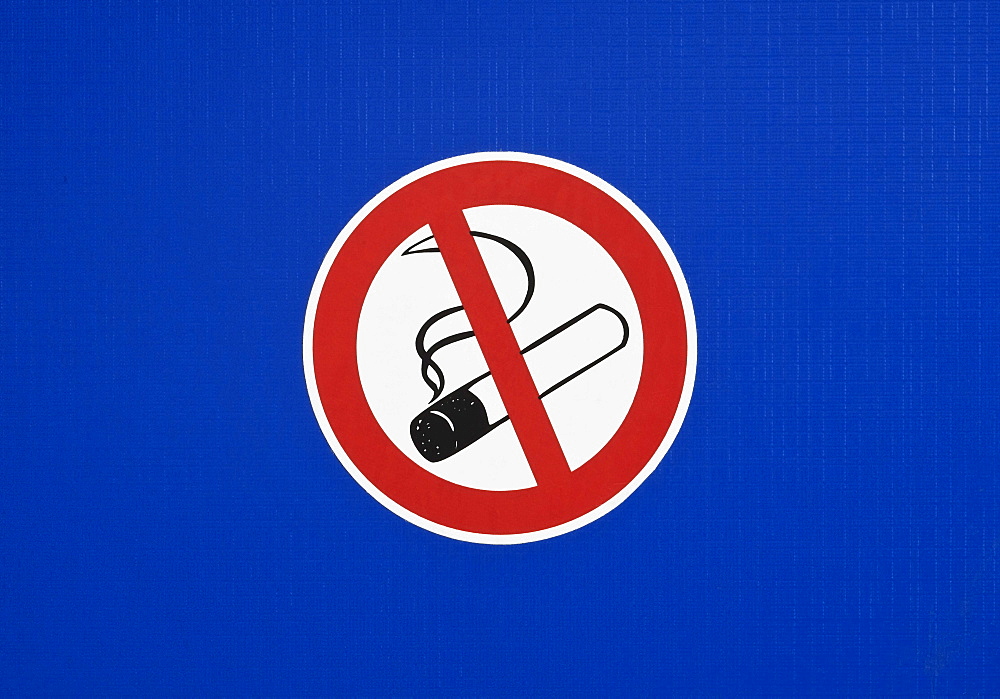 No smoking sign on a blue surface