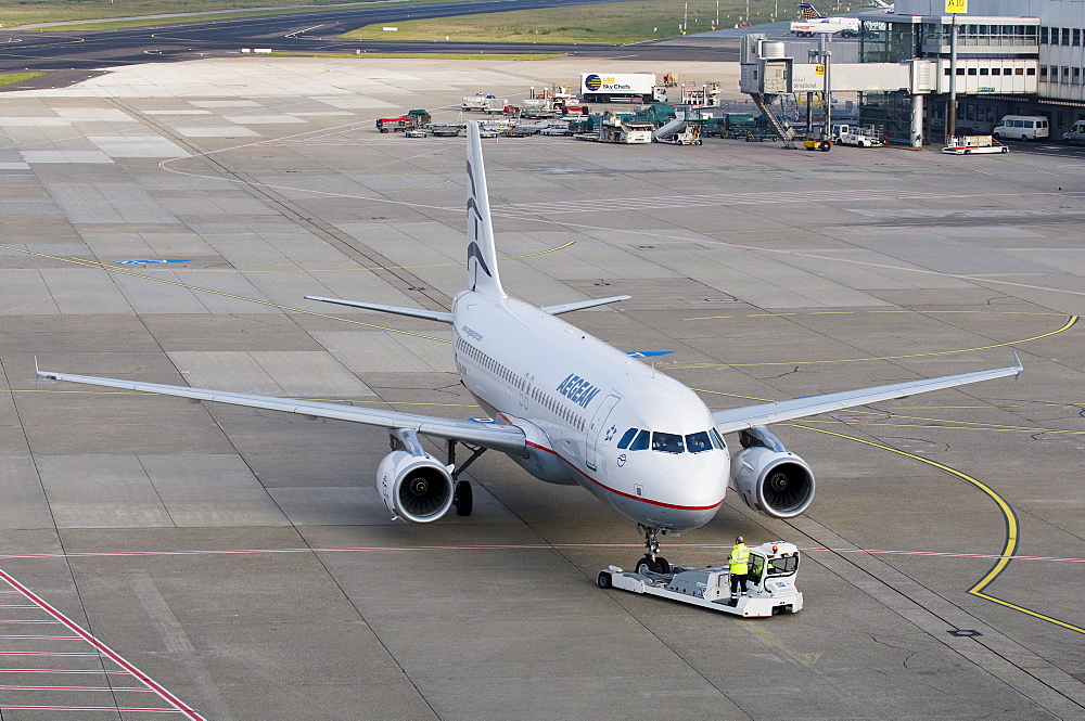 Aegean Airlines transport aircraft being manoeuvered on the runway, Dusseldorf International Airport, North Rhine-Westphalia, Germany, Europe