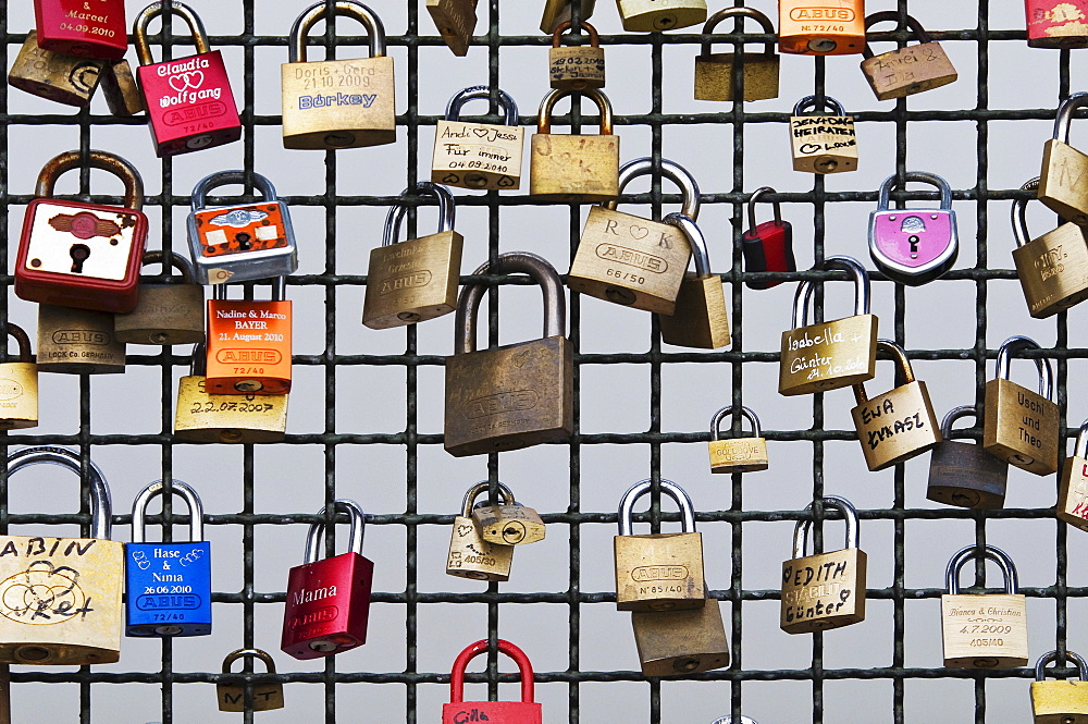 Love padlocks on the Deutzer Bruecke bridge, padlocks with names or initials left there by lovers, Cologne, North Rhine-Westphalia, Germany, Europe