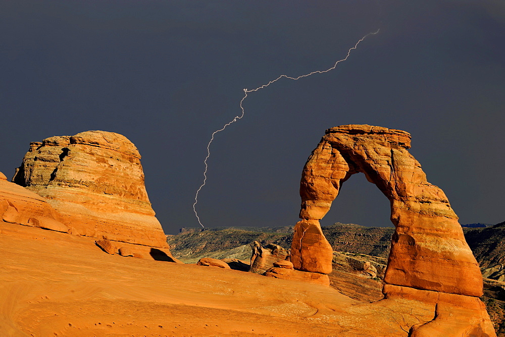 Delicate Arch, stone arch, during thunderstorm, lightning strike, Arches National Park, Moab, Utah, Southwest, USA, North America