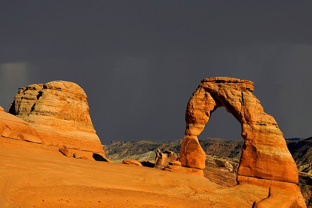 Delicate Arch, stone arch, during thunderstorm, Arches National Park, Moab, Utah, Southwest, USA, North America