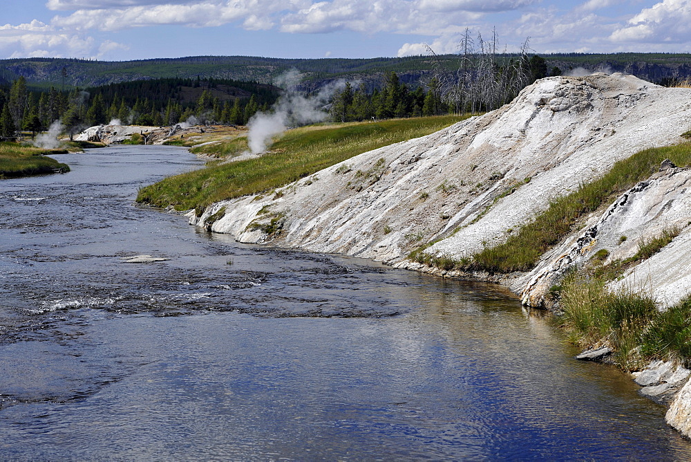 View over Firehole River, Geyser Hill, Upper Geyser Basin, geothermal springs in Yellowstone National Park, Wyoming, United States of America, USA