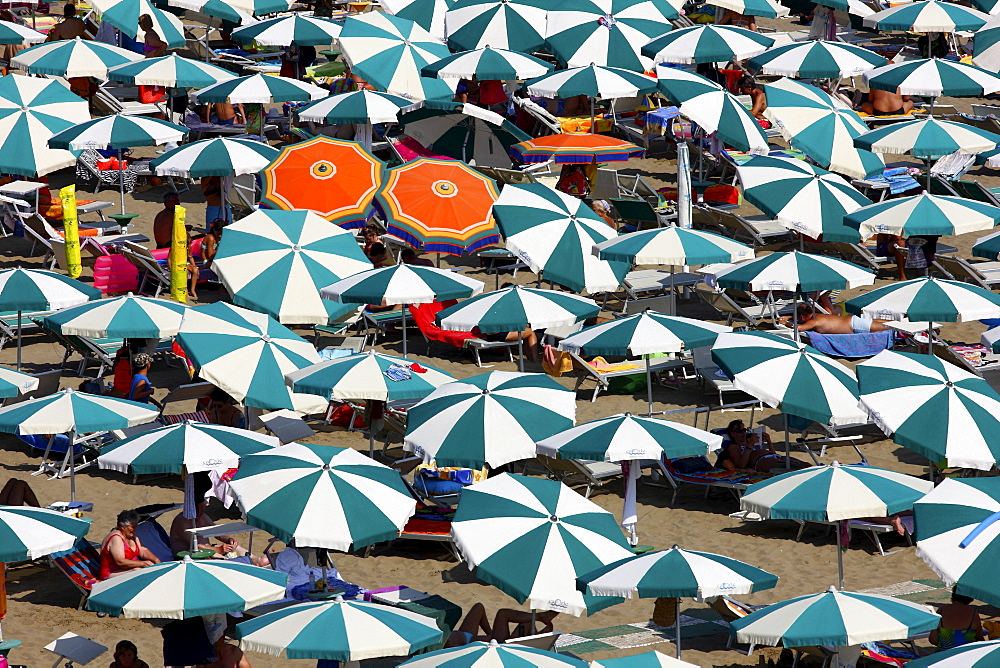 Parasols and sun loungers, mass tourism on the beach of Caorle, Adriatic Sea, Italy, Europe