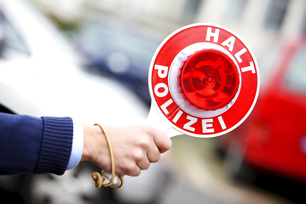 Police officer with a traffic paddle