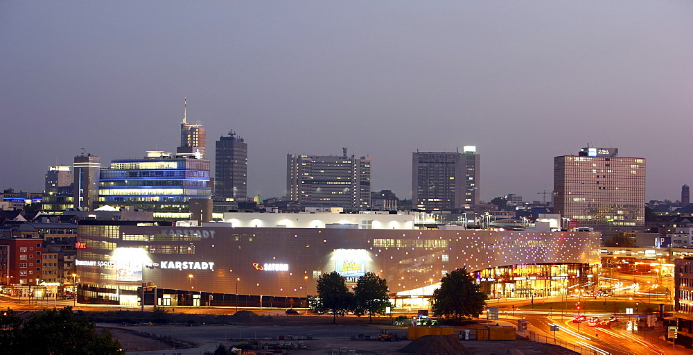 Skyline of Essen and Limbecker Platz shopping center, completed in 2009, Essen city centre, illuminated facade on Berliner Platz square, Essen, North Rhine-Westphalia, Germany, Europe