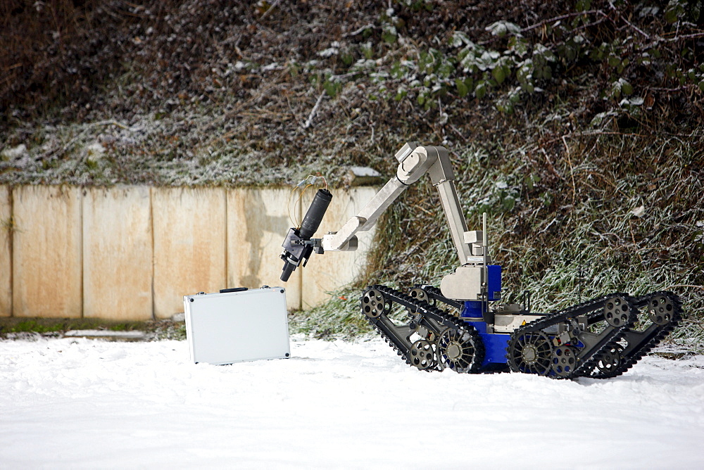 Radio control robot from the Telerob company to defuse explosives, bombs and other dangerous devices by remote control, the water gun uses extreme high pressure to render the explosive device unusable