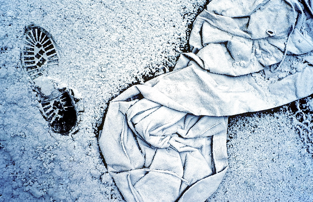 Discarded worker's clothing and a footprint, covered with hoarfrost, Huettenwerk Meiderich steel mill after closure, today Duisburg-Nord Landscape Park, North Rhine-Westphalia, Germany, Europe