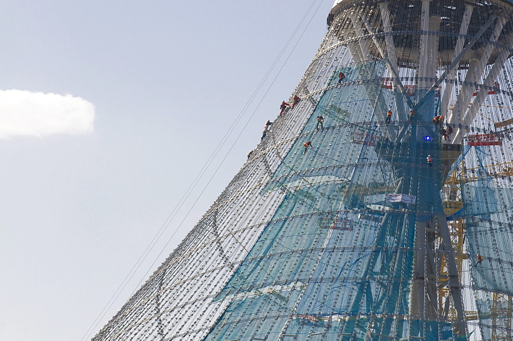 Construction workers climbing on the Khan Shatyry Entertainment Center, Astana, Kazakhstan, Central Asia