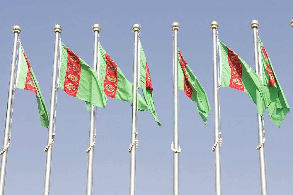 Turkmen national flags blowing in the wind, Ashgabat, Turkmenistan, Central Asia