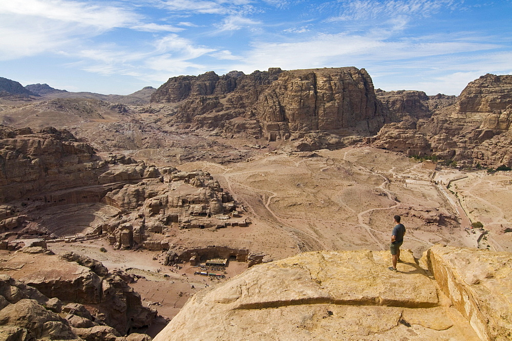 Man overlooking the ruins of the town of Petra, Jordan, Western Asia