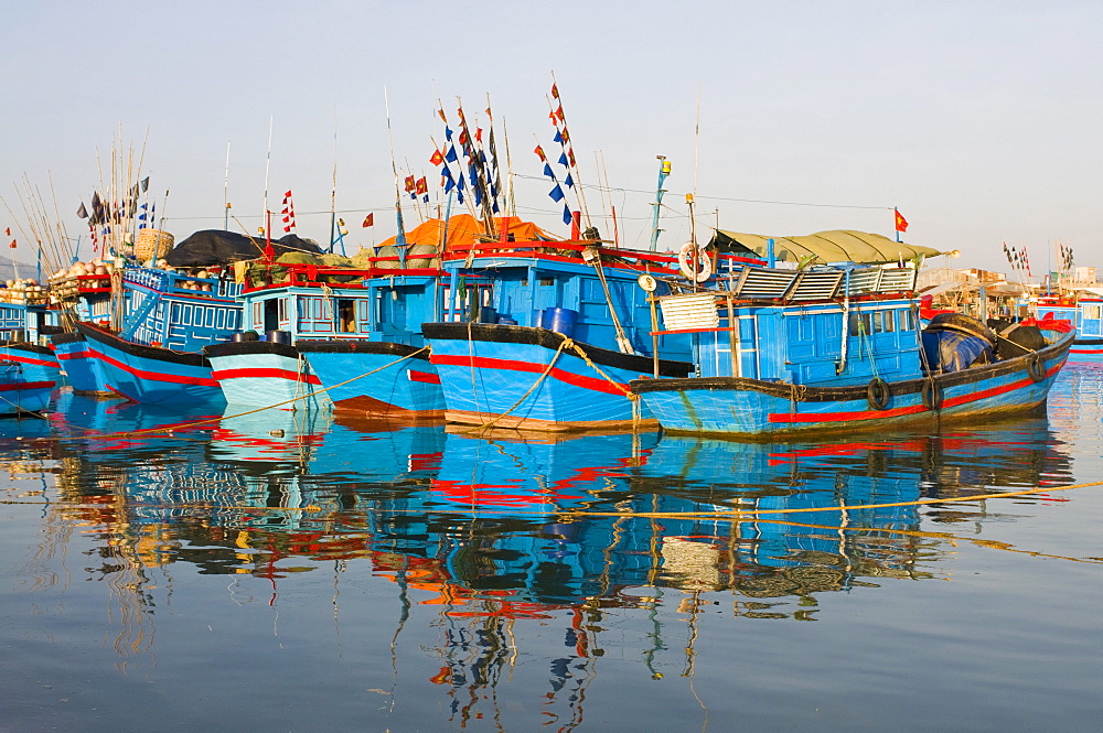 Blue fishing boats in the harbour of Nha Trang, Vietnam, Asia