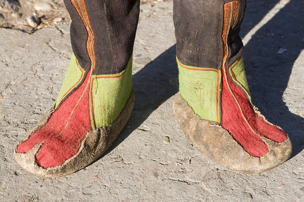 Feet of monk in traditional costume, Paro, Bhutan, Asia