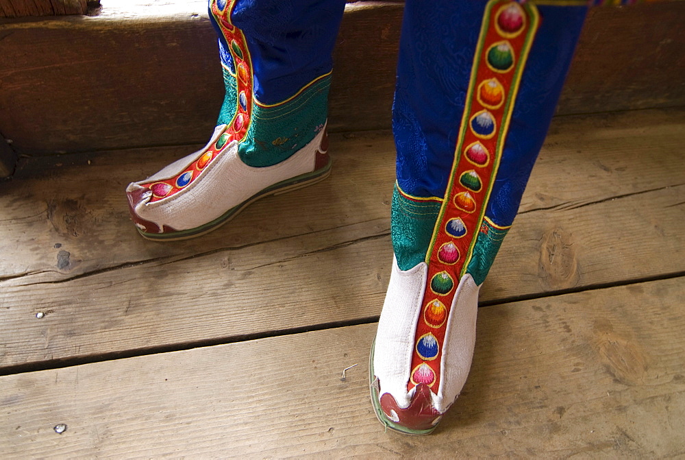 Feet of a monk dressed in traditional costume, Paro, Bhutan, Asia