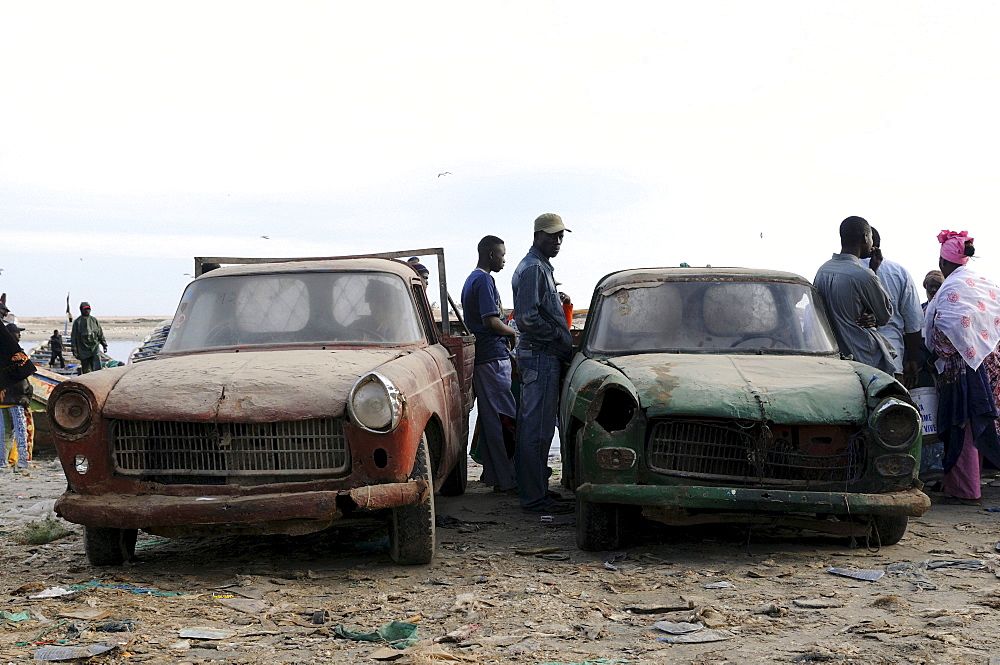 Very old rusting Peugeots on the fish market of Nouadhibou, Mauritania, northwestern Africa