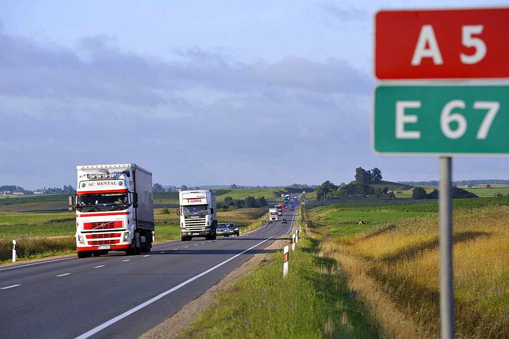 Truck transit traffic at the Transbaltica highway in the evening, European route E67 or Via Baltica, Kegums, Latvia, Baltic States, Europe