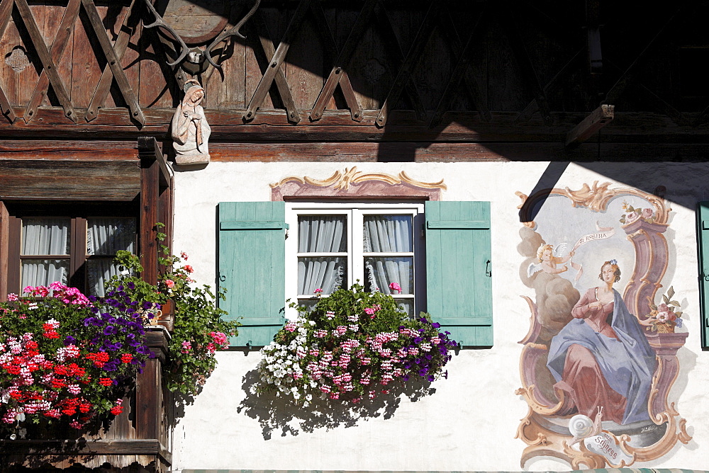 Facade of a Bavarian farmhouse with mural paintings called Lueftlmalerei on Loisachstrasse street, Garmisch district, Garmisch-Partenkirchen, Werdenfelser Land region, Upper Bavaria, Bavaria, Germany, Europe