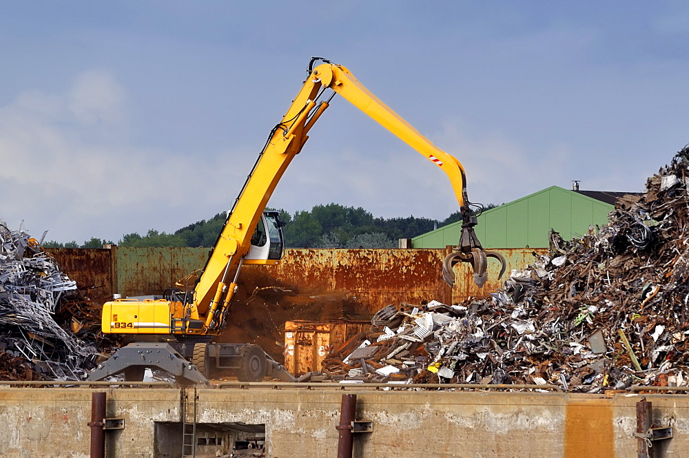 Scrap metal, recycling, dredger loading scrap metal