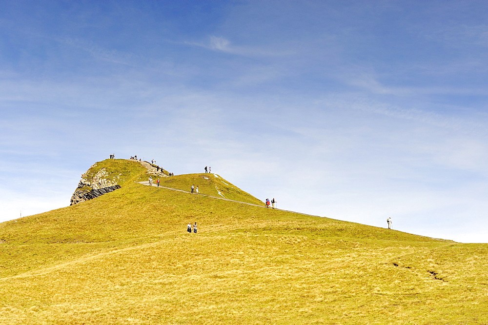 Tourists on the 2334 metre high summit of Maennlichen Mountain in the Bernese Alps, Canton of Bern, Switzerland, Europe