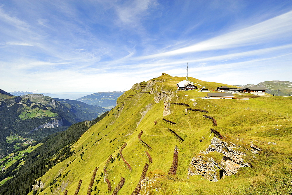 2334 metre high Maennlichen Mountain with structural avalanche defense measures and the mountain station in front of the summit, Canton of Bern, Switzerland, Europe