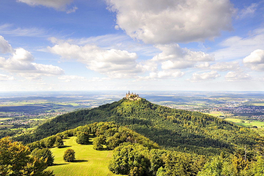 View over the Zellerhornwiese pasture on Burg Hohenzollern castle from Mt. Zeller Horn, Zollernalbkreis county, Baden-Wuerttemberg, Germany, Europe