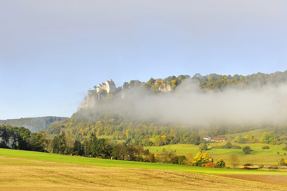 Misty atmosphere with Schloss Werenwag Castle in the autumnal Upper Danube Valley, district of Sigmaringen, Baden-Wuerttemberg, Germany, Europe